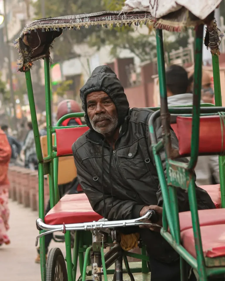 Cycle-rickshaw puller waiting for passengers in Old Delhi