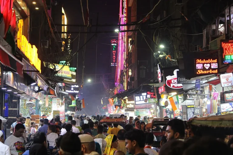 Old Delhi bazaar lit up at night on a Delhi shopping tour